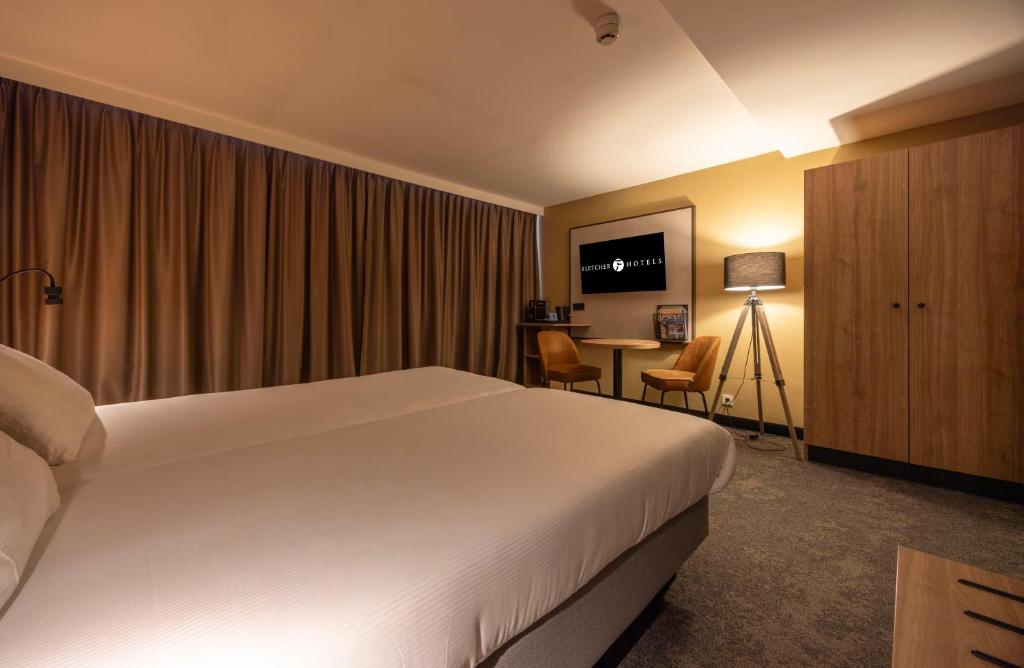 TV a/nebo společenská místnost v ubytování Fletcher Hotel-Restaurant Klein Zwitserland