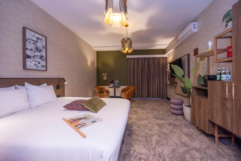 Postel nebo postele na pokoji v ubytování Fletcher Hotel-Restaurant Klein Zwitserland