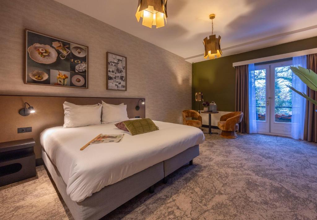 Postel nebo postele na pokoji v ubytování Fletcher Hotel-Restaurant Klein Zwitserland
