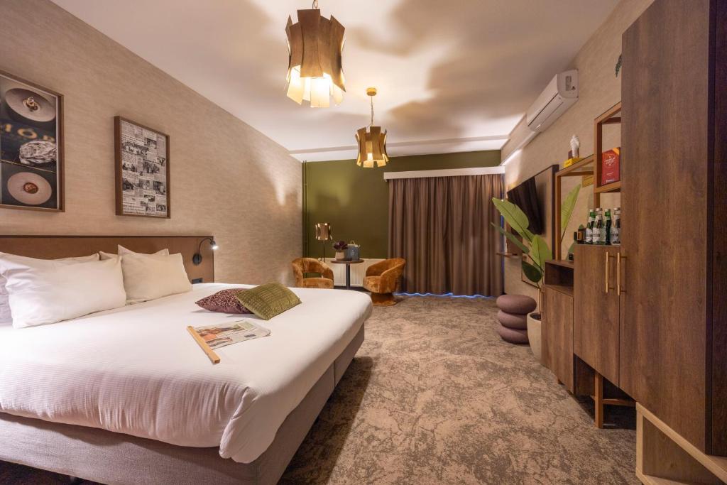Postel nebo postele na pokoji v ubytování Fletcher Hotel-Restaurant Klein Zwitserland