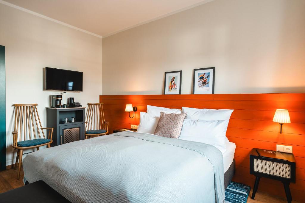 Postel nebo postele na pokoji v ubytování HENRI Country House Kitzbühel