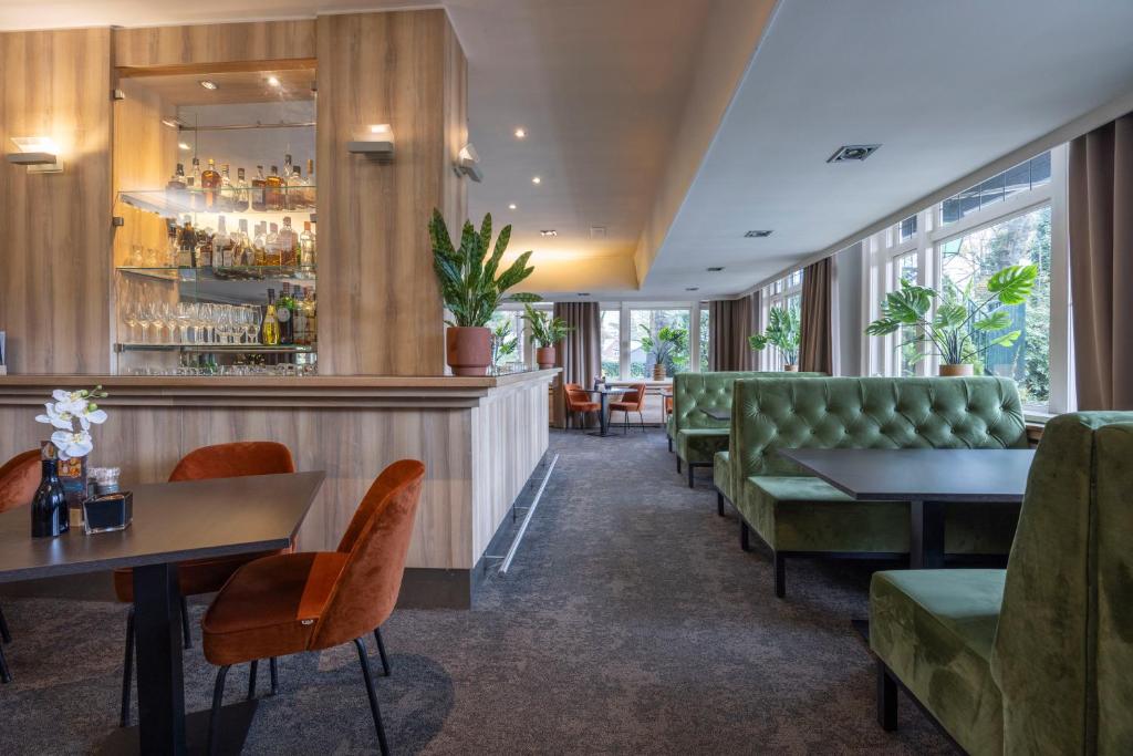 Posezení v ubytování Fletcher Hotel-Restaurant Klein Zwitserland