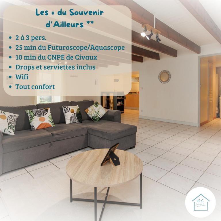 a living room with a couch and a table at LE SOUVENIR D'AILLEURS T2 65m2 in Lhommaizé