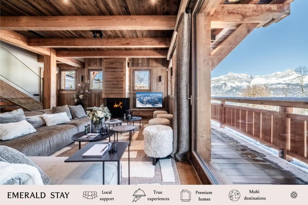 a living room with a couch and tables and a fireplace at Chalet Betula, Saint-Gervais - by EMERALD STAY in Saint-Gervais-les-Bains