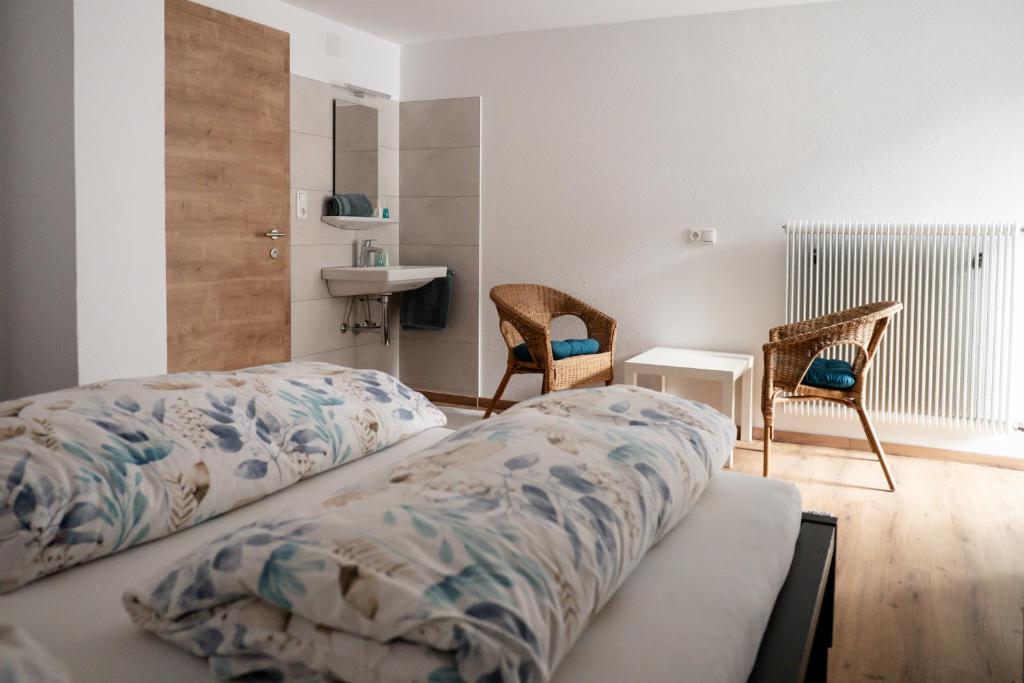 Postel nebo postele na pokoji v ubytování Gästehaus Schoder