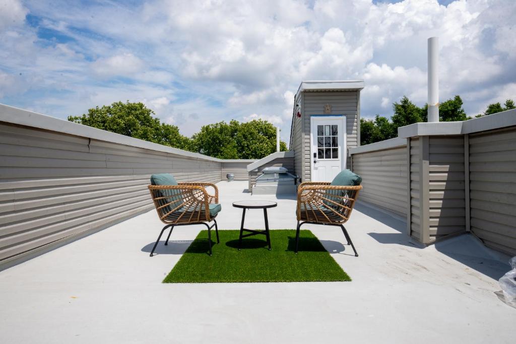 two chairs and a table on a patio at Diamond Suites Philadelphia Center in Philadelphia