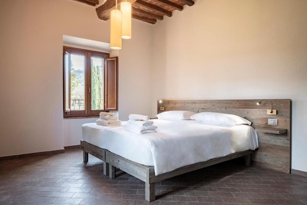 Posteľ alebo postele v izbe v ubytovaní Agriresort La Colombaia