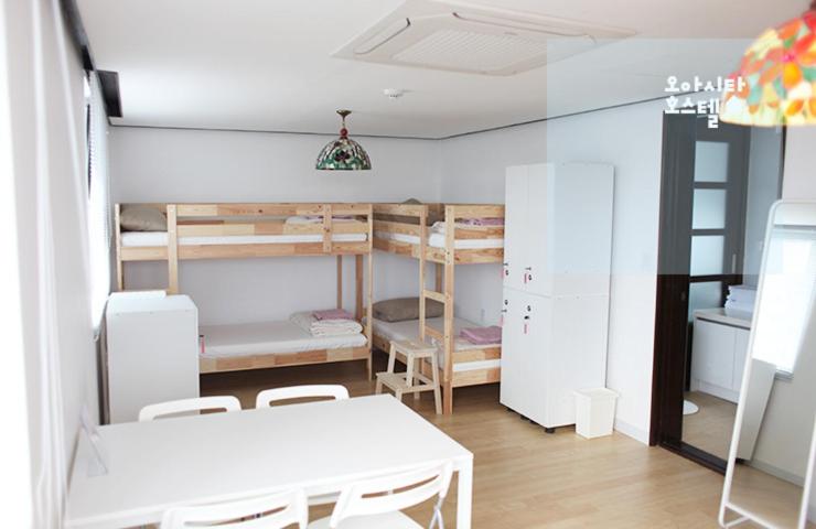 Postel nebo postele na pokoji v ubytování Oasita Hostel