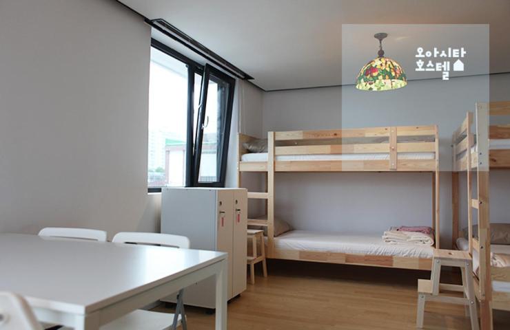 Postel nebo postele na pokoji v ubytování Oasita Hostel