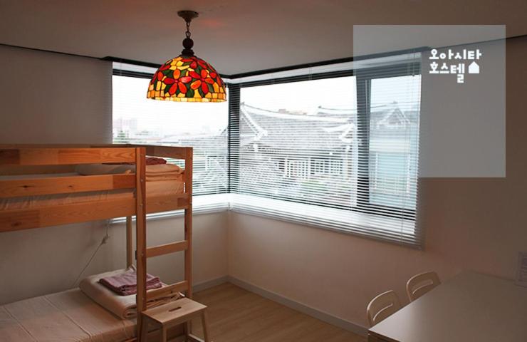 Postel nebo postele na pokoji v ubytování Oasita Hostel