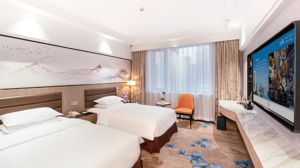 Postel nebo postele na pokoji v ubytování Hotel Landmark Canton