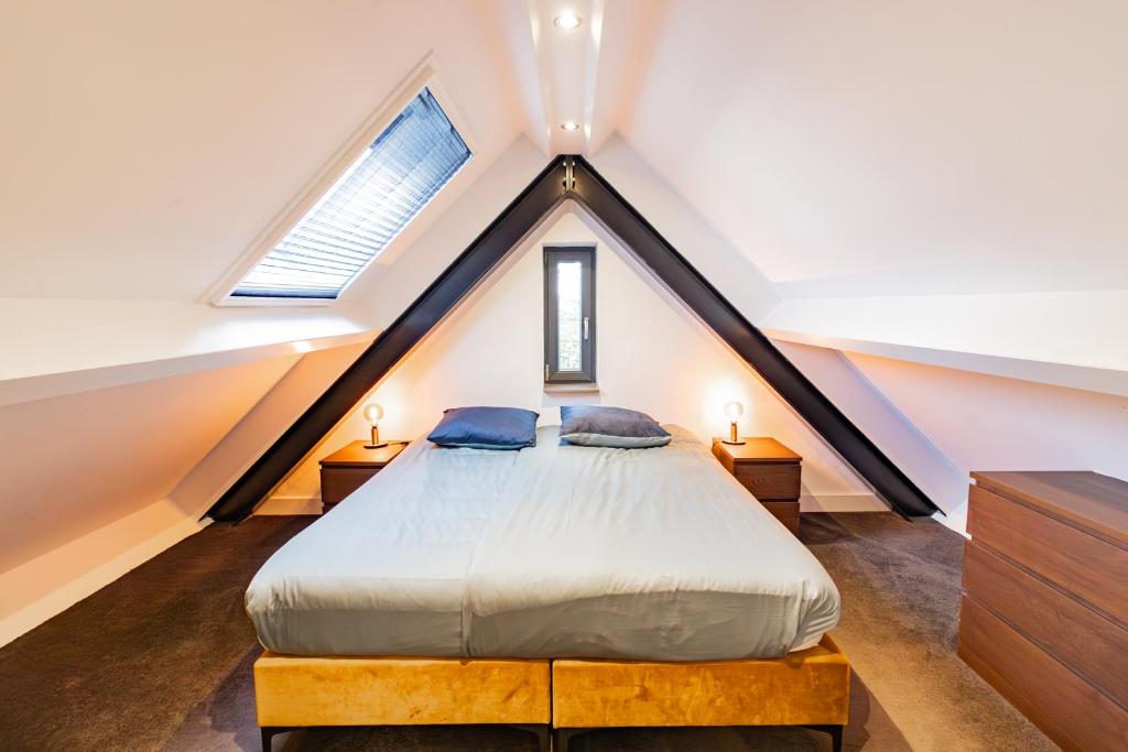 Postel nebo postele na pokoji v ubytování Boerderijkamer Horizon
