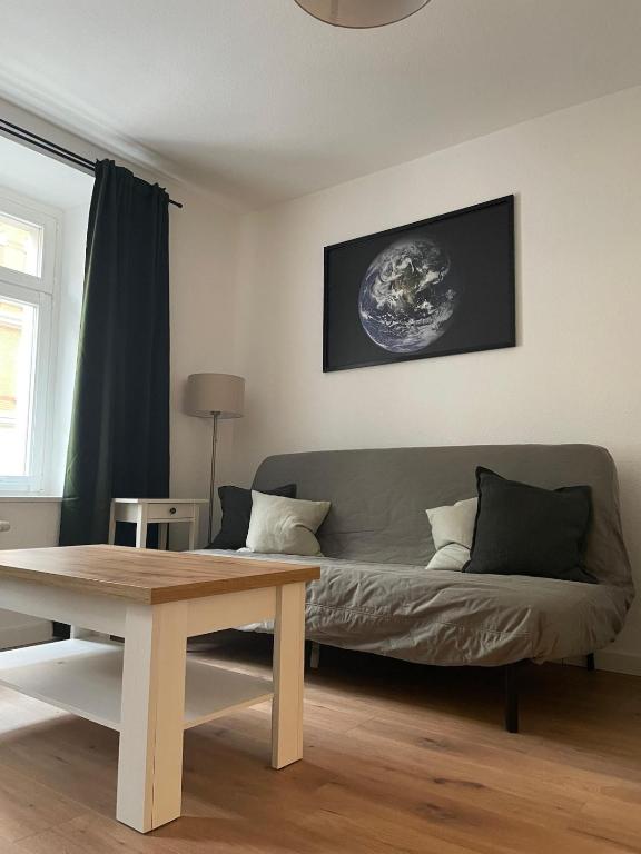 a living room with a couch and a table at Apartment in Reudnitz in Leipzig