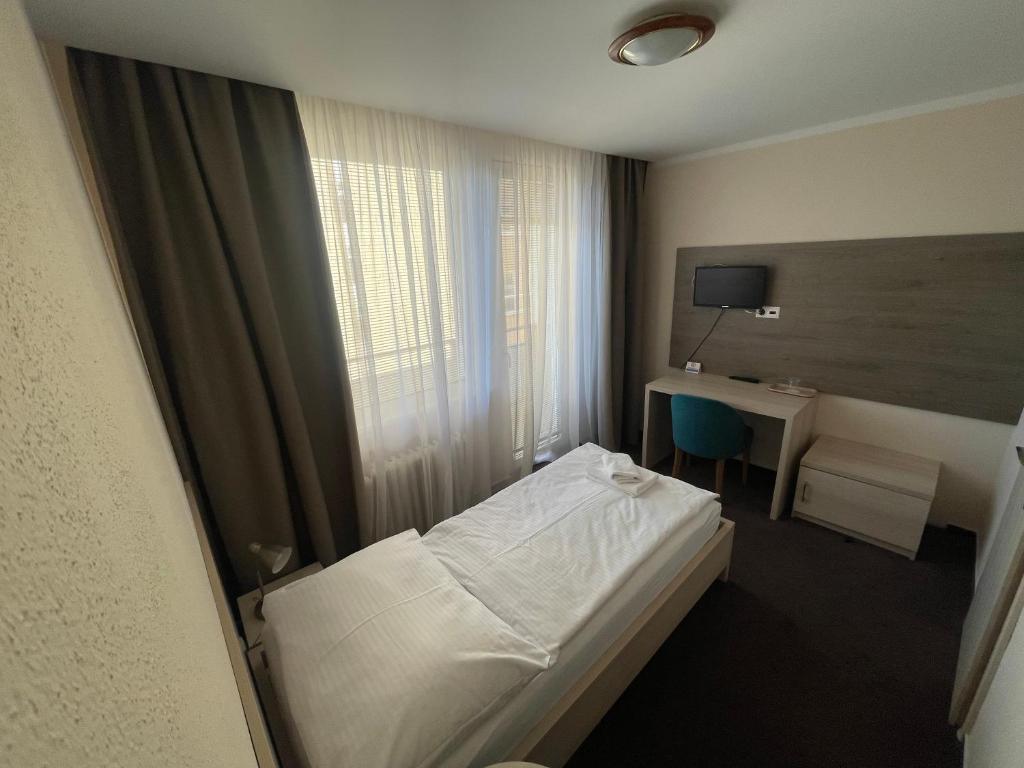 Postel nebo postele na pokoji v ubytování Hotel SPECTRUM