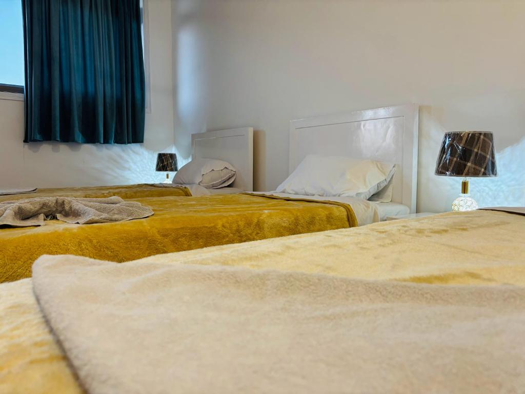 Postel nebo postele na pokoji v ubytování Luxor View Hostel