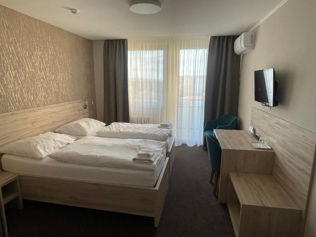Postel nebo postele na pokoji v ubytování Hotel SPECTRUM