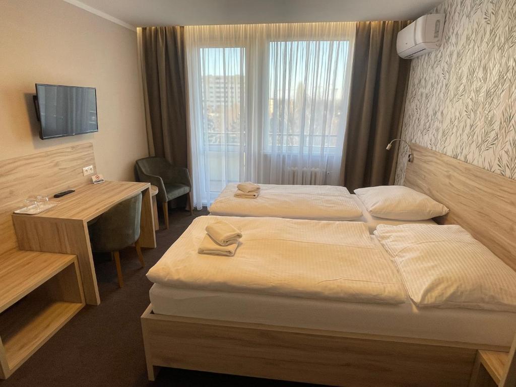 Postel nebo postele na pokoji v ubytování Hotel SPECTRUM