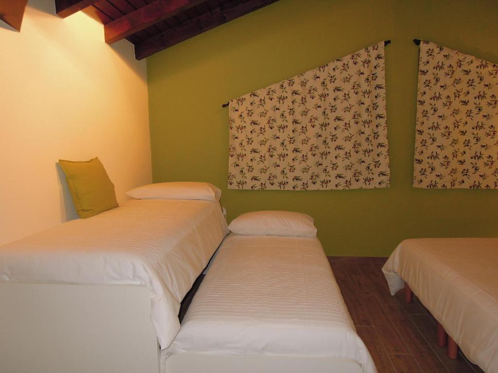 Postel nebo postele na pokoji v ubytování B&B Family and Group Bell'Ulivo