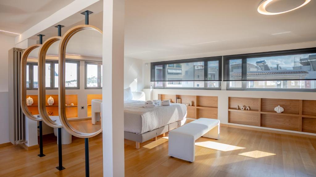 Postel nebo postele na pokoji v ubytování Apeiron Athena Residences