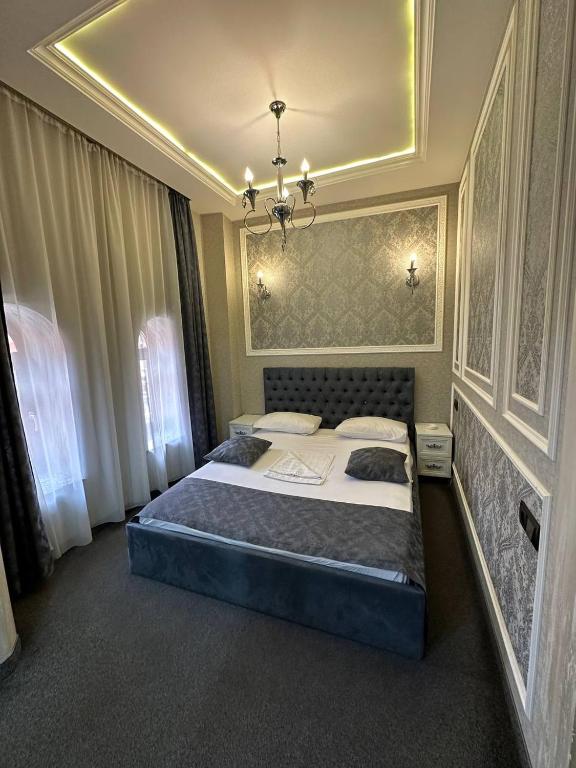 Postel nebo postele na pokoji v ubytování Hotel Roma & Tours