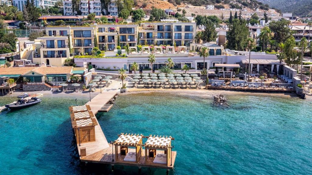 an aerial view of a resort with a dock in the water at Casa Nonna Bodrum - Adult Only in Bodrum City