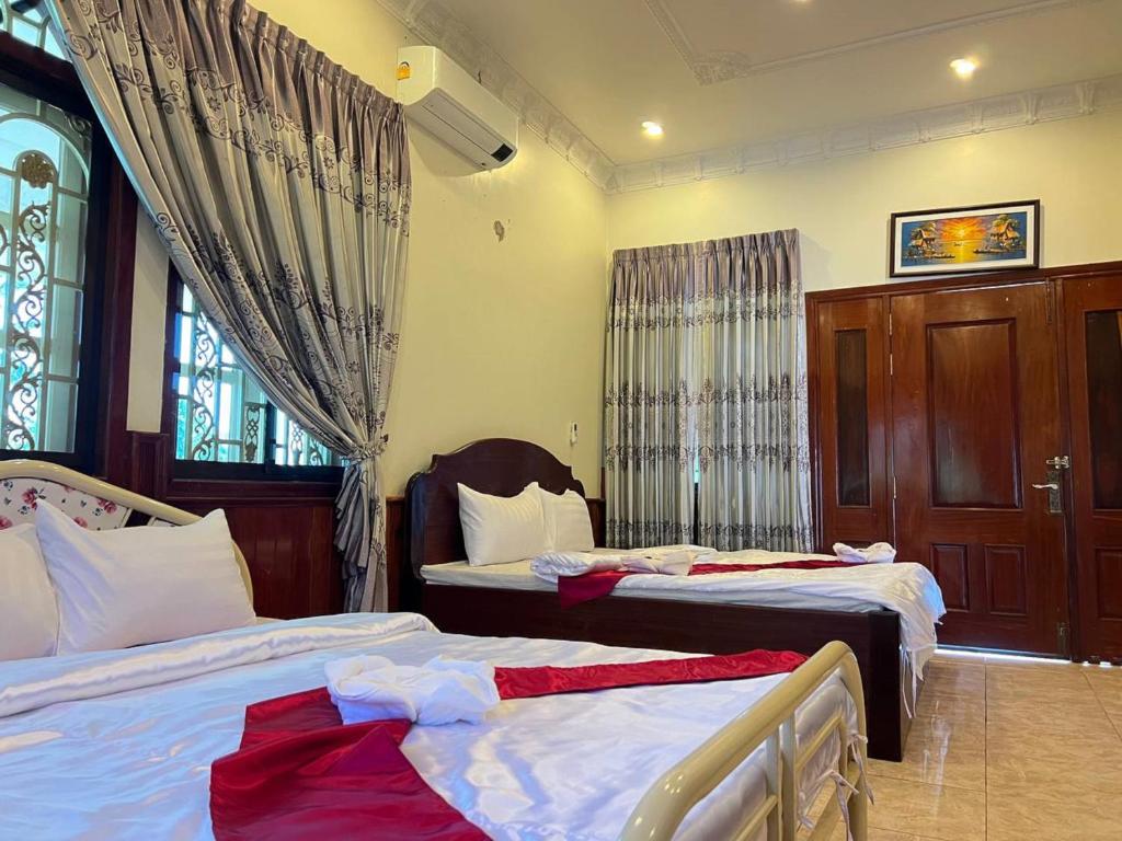 Postel nebo postele na pokoji v ubytování Lotus Blanc Homestay Villa