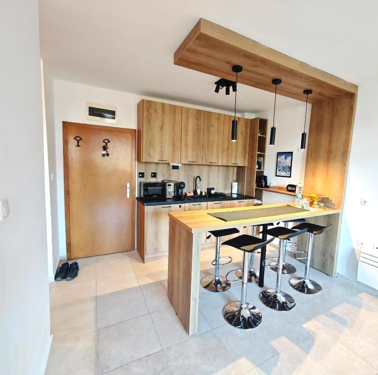 Kuchyň nebo kuchyňský kout v ubytování Friendly apartment -top location