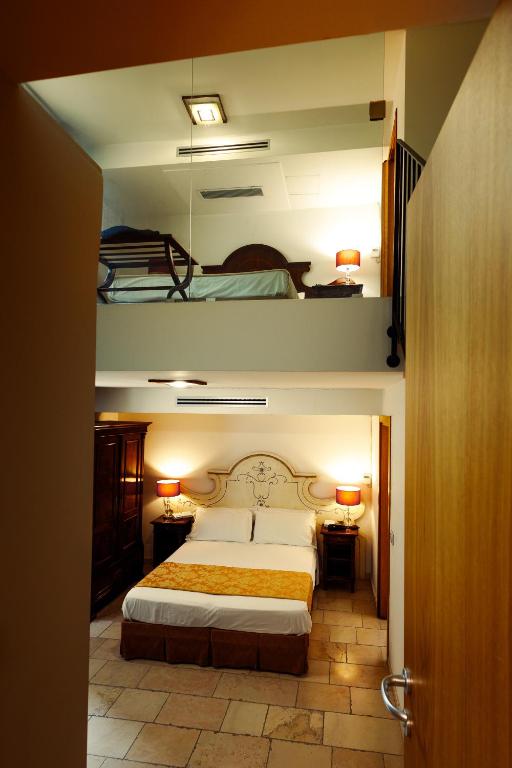 Postel nebo postele na pokoji v ubytování Vico Regio Hotel