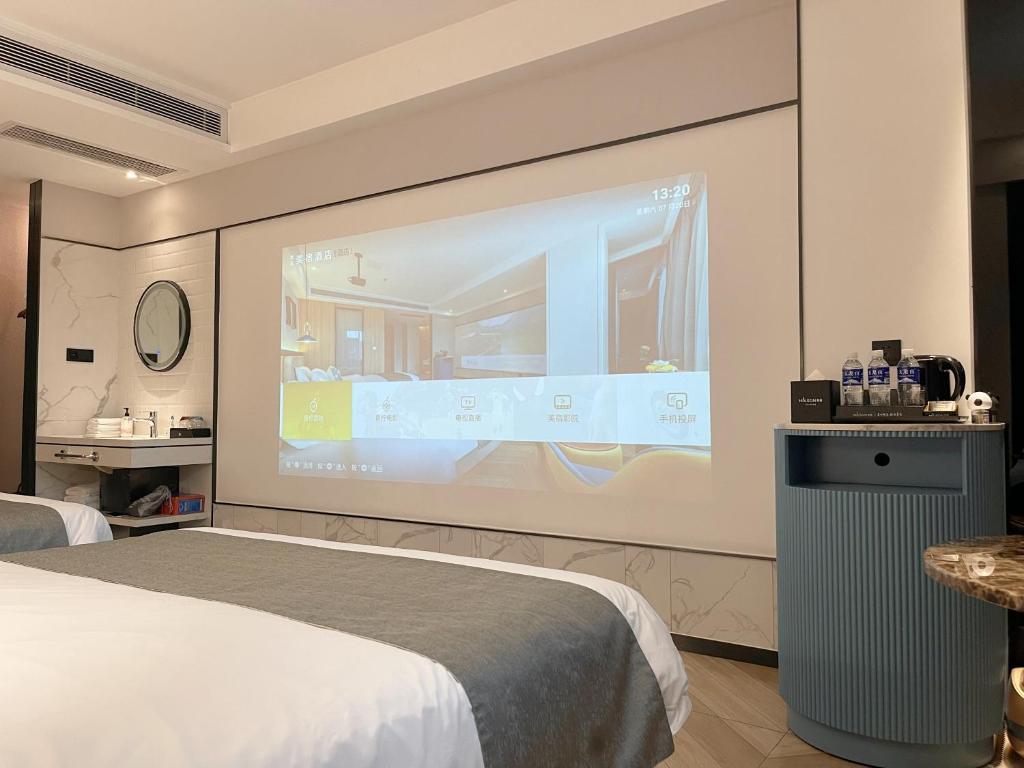 Postel nebo postele na pokoji v ubytování Lijiang MΛISON Hotel