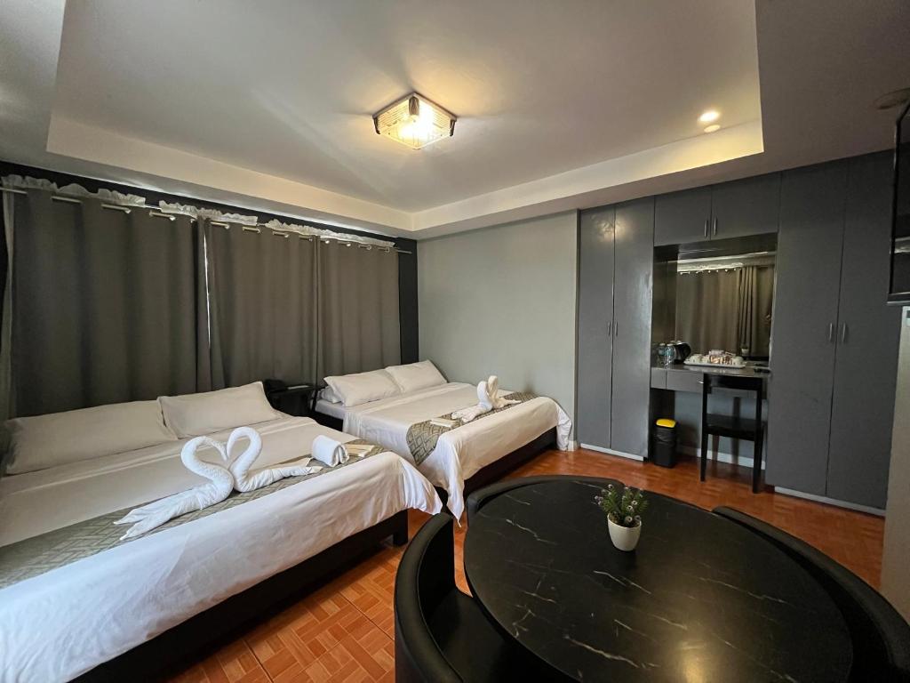 Postel nebo postele na pokoji v ubytování Rangya Hotel