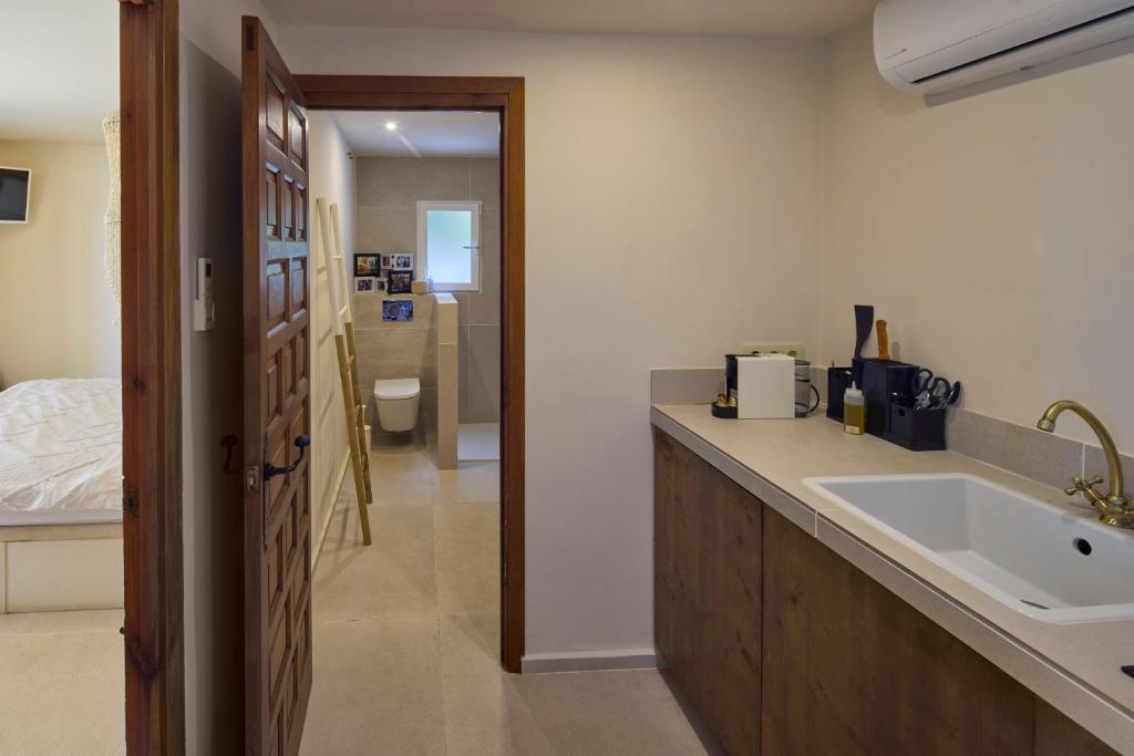a bathroom with a sink and a counter top at Casa El Sueño in Jávea