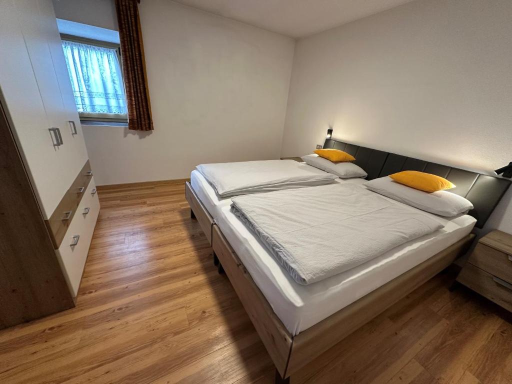 Postel nebo postele na pokoji v ubytování Ciasa Alfri
