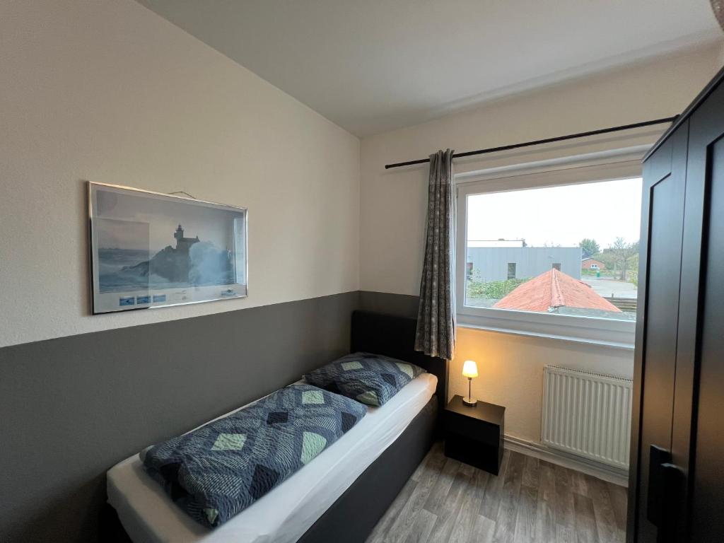 Postel nebo postele na pokoji v ubytování Hotel am Hafen