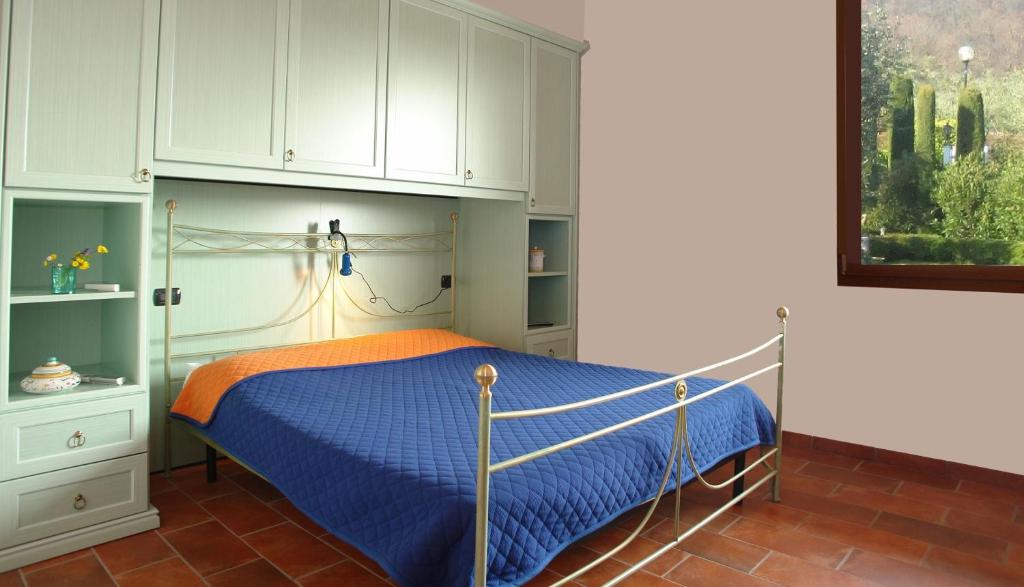 Postel nebo postele na pokoji v ubytování B&B Agli Ulivi