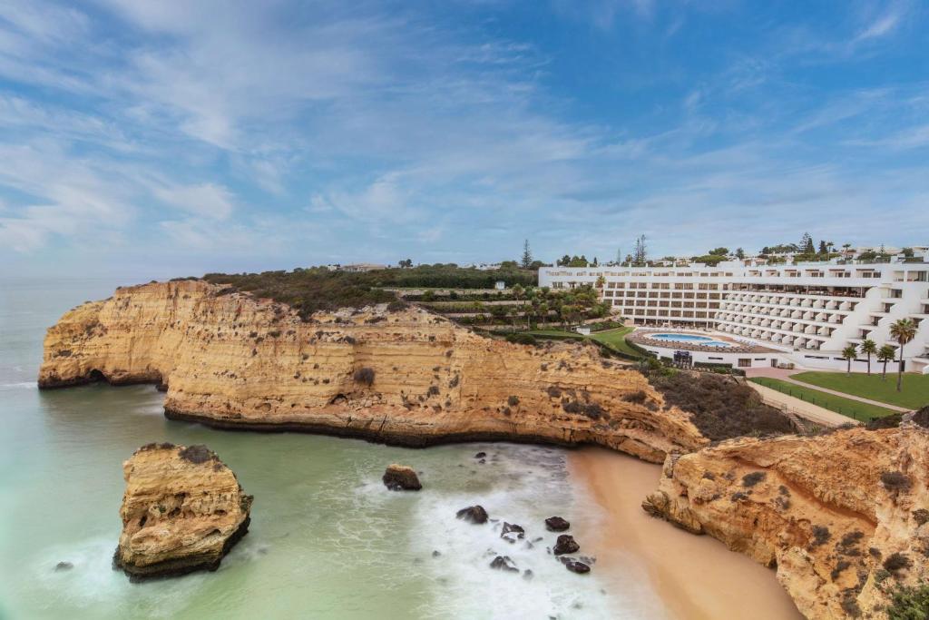 an aerial view of a hotel and a beach with rocks at Tivoli Carvoeiro in Carvoeiro