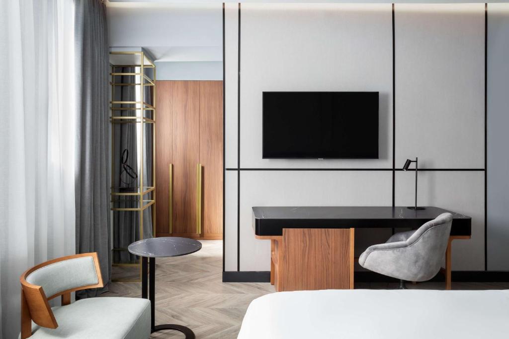 A television and/or entertainment centre at Radisson Collection Bilbao