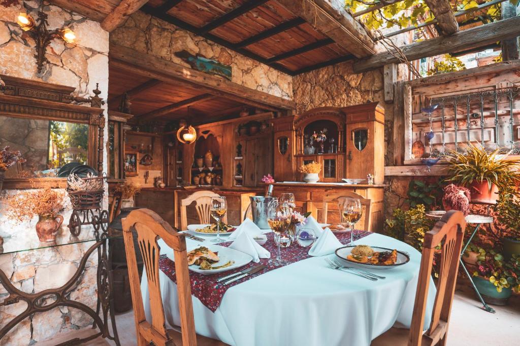 a dining room with a table with food on it at Fidanka Hotel in Kalkan