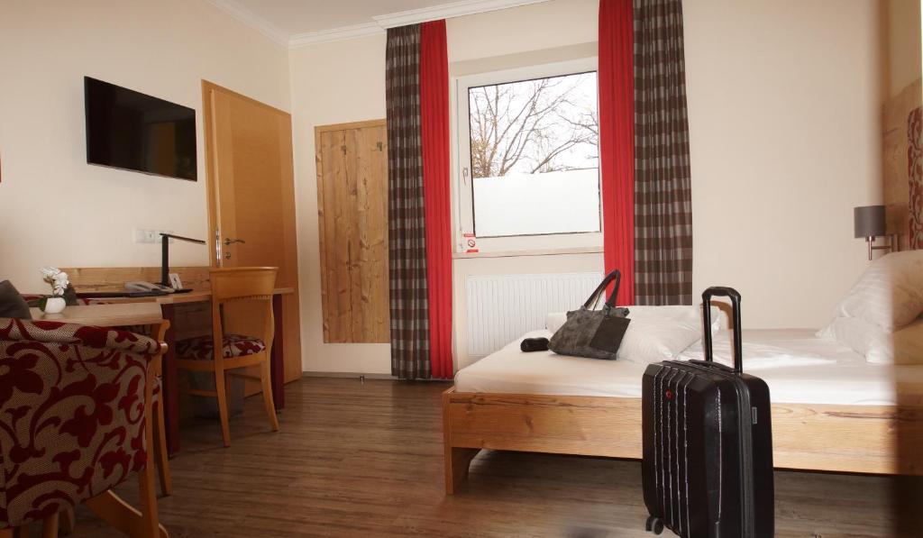 TV a/nebo společenská místnost v ubytování Der Marienhof Hotel Garni
