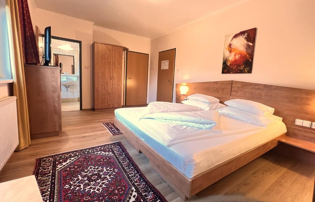 Postel nebo postele na pokoji v ubytování Der Marienhof Hotel Garni