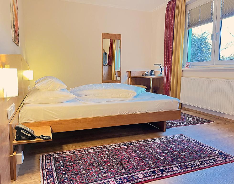 Postel nebo postele na pokoji v ubytování Der Marienhof Hotel Garni