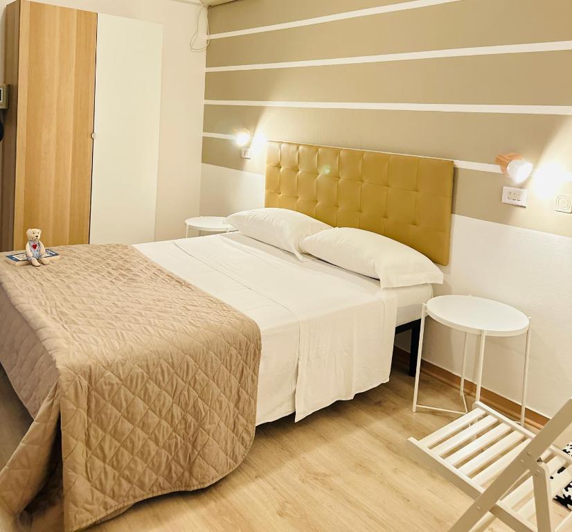 Postel nebo postele na pokoji v ubytování Hotel Villa Perazzini