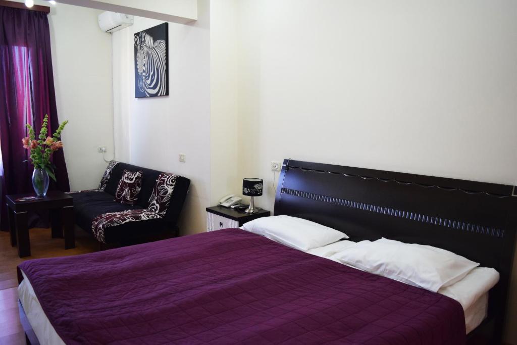 Postel nebo postele na pokoji v ubytování Hotel Grig