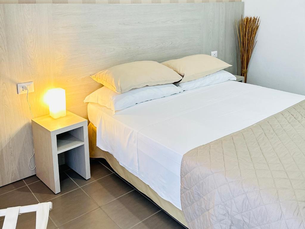 Postel nebo postele na pokoji v ubytování Hotel Villa Perazzini