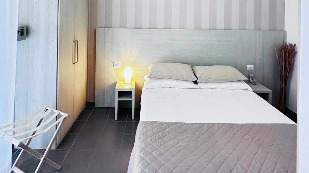 Postel nebo postele na pokoji v ubytování Hotel Villa Perazzini