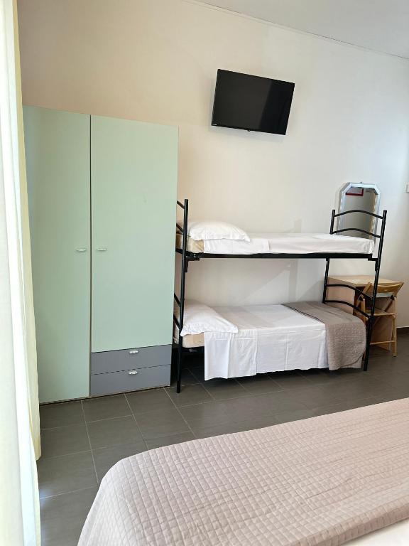 Postel nebo postele na pokoji v ubytování Hotel Villa Perazzini
