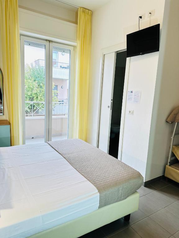 Postel nebo postele na pokoji v ubytování Hotel Villa Perazzini