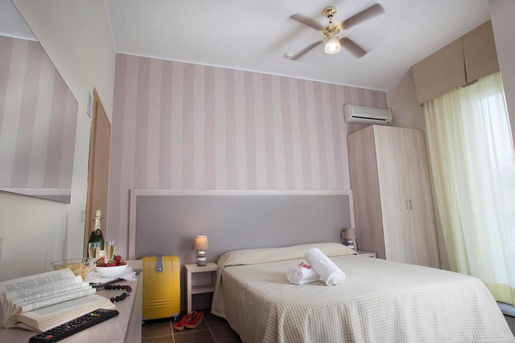 Postel nebo postele na pokoji v ubytování Hotel Villa Perazzini