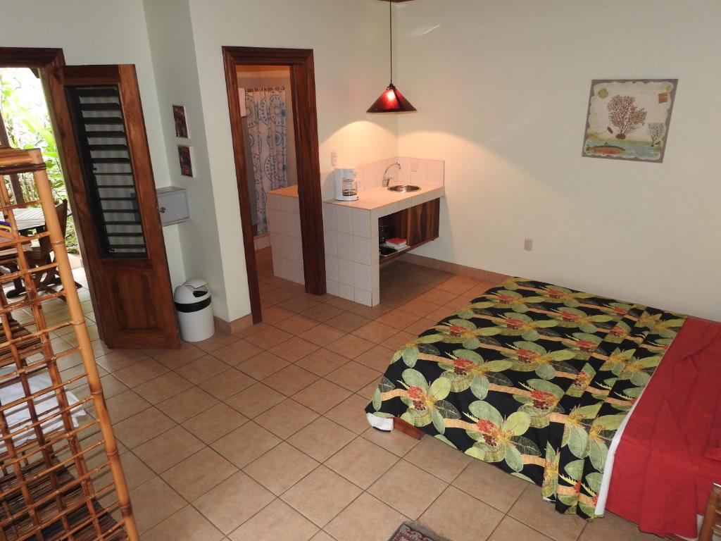 Postel nebo postele na pokoji v ubytování Playa Negra Guesthouse