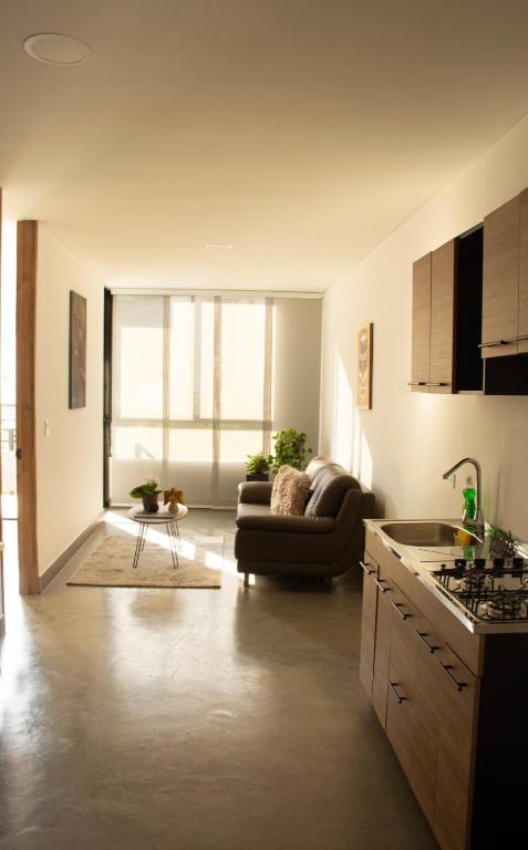 a living room with a couch and a table at Norte Cali - Bosque Living- 301 in Cali