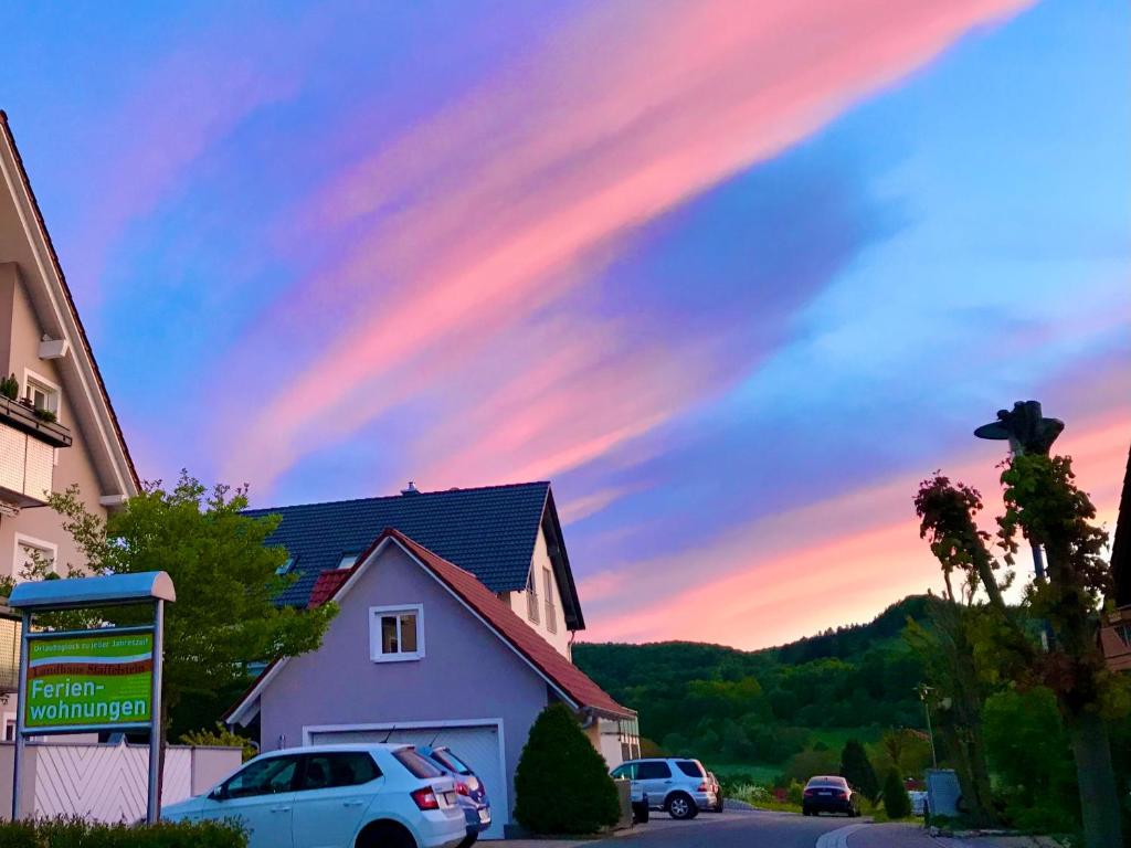 a rainbow in the sky over a house at Apartment Schwabthal by Landhaus Staffelstein in Bad Staffelstein